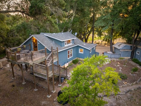 Outdoor dining on the wraparound deck feels tucked into the trees