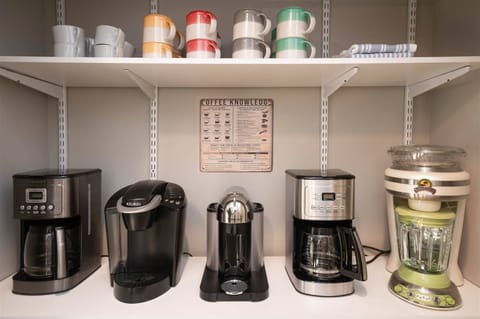 Start your mornings right at this fully stocked coffee station featuring multiple brew options.