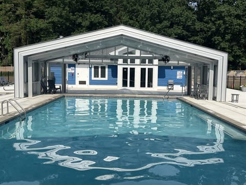 Enjoy the Harbor Club's spacious indoor/outdoor pool with retractable enclosure, perfect for swimming in any weather.