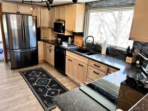 Fully stocked kitchen equipped with all new appliances & cookware by Cuisinart.