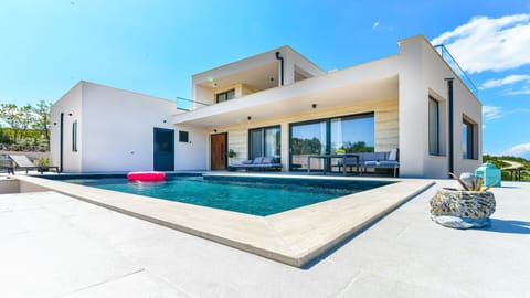Main entrance, terrace, swimming pool