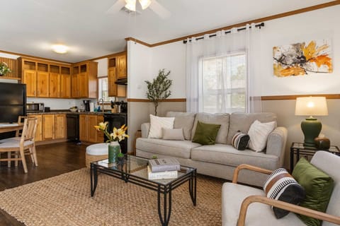 The wide-open floor plan here means everyone's part of the conversation, no matter if they're in the kitchen, dining area, or living room.