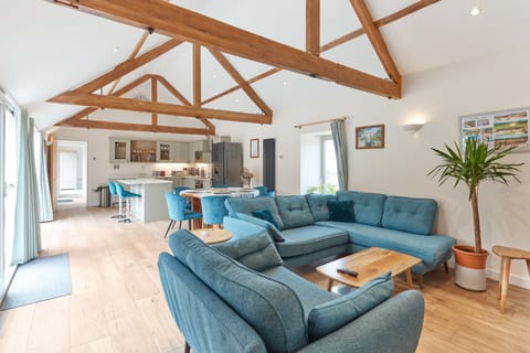 Large living area with sofas, dining tables and breakfast bar