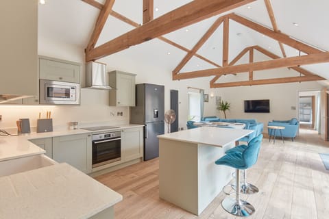 Large living area with underfloor heating and radiators