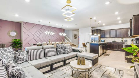 Spacious open-concept living with luxe lounge, gourmet kitchen, and designer dining.