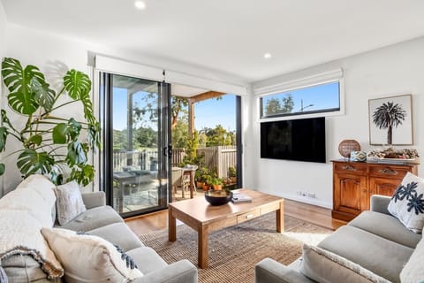 Enjoy the light and airy living spaces and peaceful location. The boardwalk over the road overlooks wetlands 