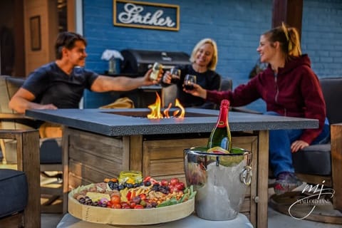 Gather around the fire pit in our backyard oasis.