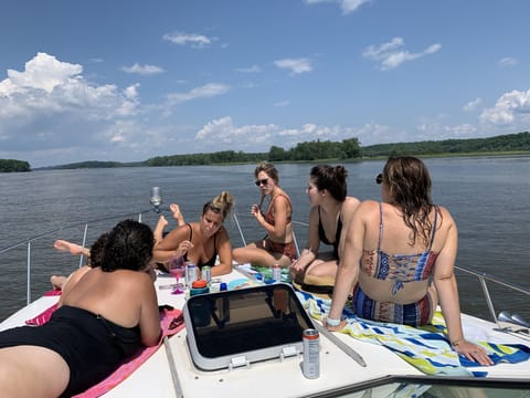 Book a charter to catch some rays on Hudson River after a day of swimming!