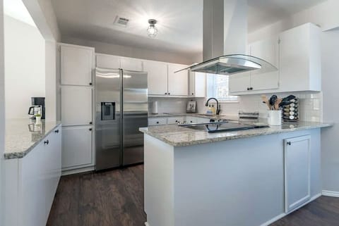 This kitchen has everything you need to cook and entertain. All new appliances and cookware.