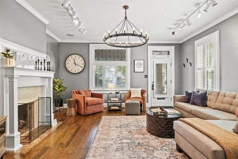 Living room with an open and airy feel with views out to the street and front porch