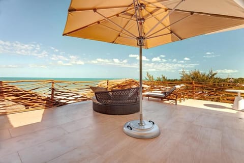 Soak up endless ocean views from your sunlit rooftop terrace.