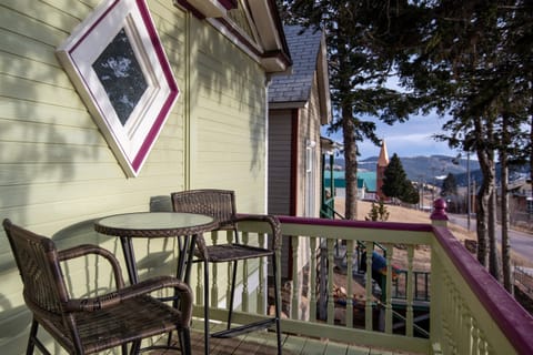 There is outdoor seating overlooking the mountains and city in front, and also a patio in back with private grill and seating area