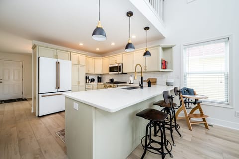 Kitchen with bar stools & high chair