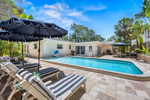 Slip into your own private paradise with this crystal-clear heated pool, surrounded by tropical palms and sun-kissed tranquility.