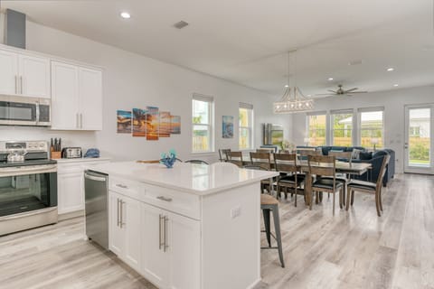 Kitchen is behind the dining area.