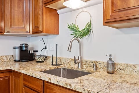 Modern Kitchen with Granite Countertops & Coffee Station