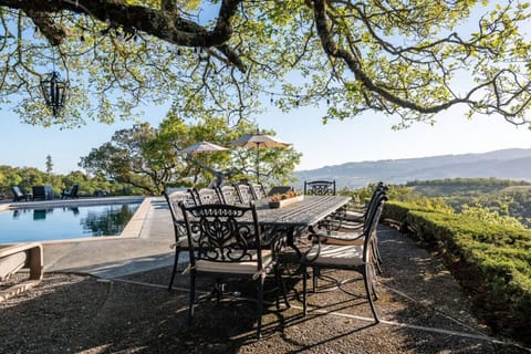 This outdoor dining area is a perfect way to end a day in the pool!