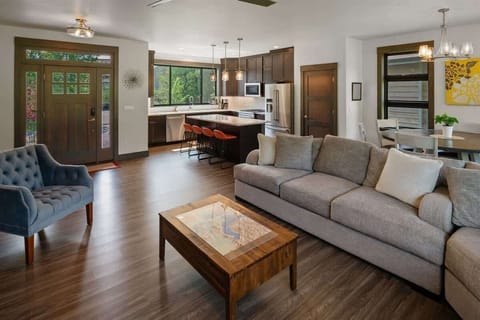 Open layout to have conversations with family in the living room, dining room, and kitchen
