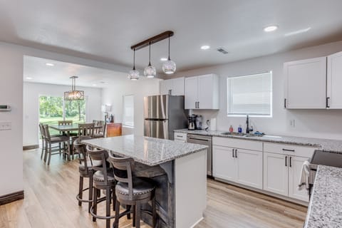 Kitchen with lots of dishes and supplies