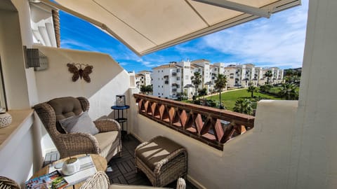 View from terrace. A real sun-trap, sheltering from wind. Extendable awning