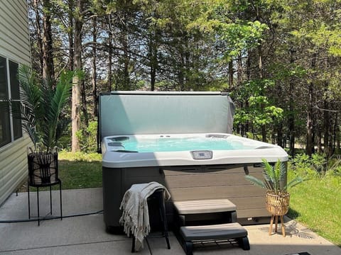 The hot tub is convenientlylocated on lower level right outside the game room in the basement.