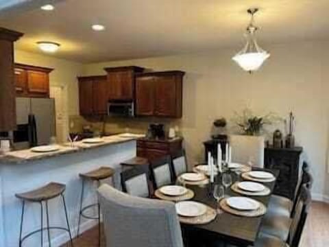 This table can be expanded to seat 12, when pulling the bench from the living room to the table.