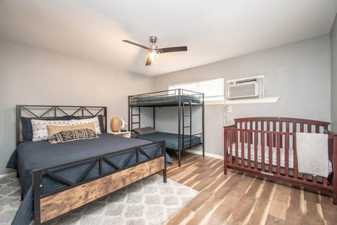 Master bedroom with Queen bed, twin bunk bed and crib