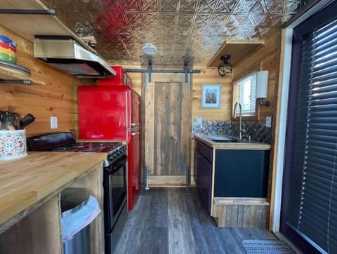 Inside the tiny home featuring a good sized kitchen.