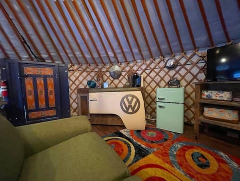 Unique hand built furnishings.  Mini fridge for keeping food inside the yurt/