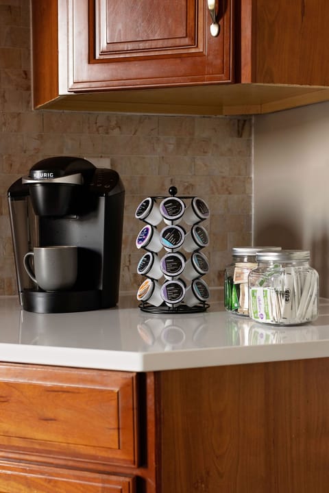 Keurig machine, 3 different varieties of coffee, sugar, and mini creamers