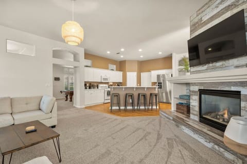 Lounge in our open concept living room with a fireplace and Roku Smart TV. We have free Netflix, HBO Max, and Hulu included!