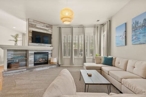 Lounge in our open concept living room with a fireplace and Roku Smart TV. We have free Netflix, HBO Max, and Hulu included!