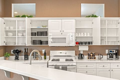 Cook delicious meals in our Chef's kitchen, fully stocked with coffee, cookware, dishes, silverware, oil, spices, and all your other cooking needs.