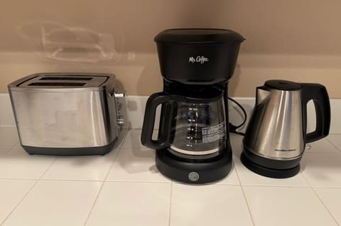 A regular drip coffee pot, and electric tea kettle, and a toaster available, perfect for quick breakfasts.