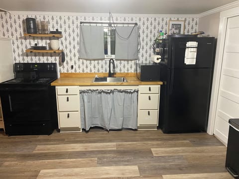 Full size appliances and cookware/dishes/utensils available for meal prep.