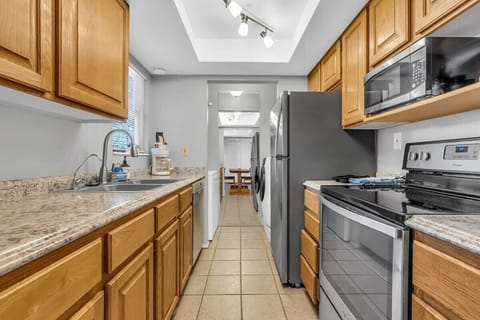 The kitchen makes efficient use of its space with plenty of counter space and cabinet storage to make meal prep a breeze.