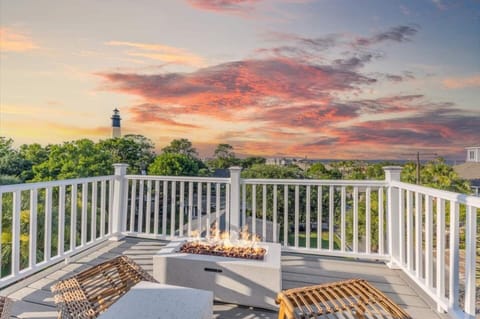 Best view of the home  4th floor with the best beach views and lighthouse views outdoor balcony. This level has a gas firepit two chairs and an umbrella for the raining days.  