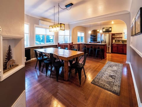 A large dining room on the main floor of the primary home seats eight with room for 3 more at the breakfast bar.