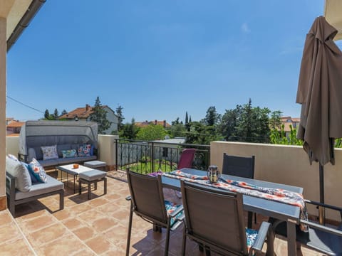Sky, Table, Property, Furniture, Shade, Architecture, Chair, Plant, Outdoor Furniture, Building