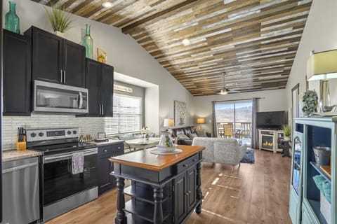 Open living space featuring vaulted ceilings.