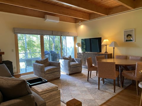 Living room has mini split A/C to keep cool in summer and warm in winter.