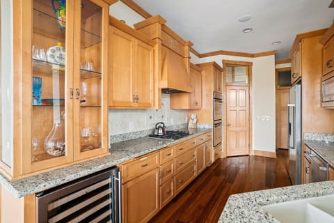 Wine Fridge, Gas Range Cook Top, Dual Ovens, French door refrigerator, dishwasher, microwave and walk in pantry
