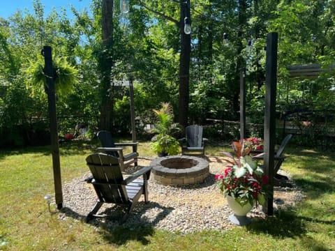 fire pit and 4 Adirondack chairs