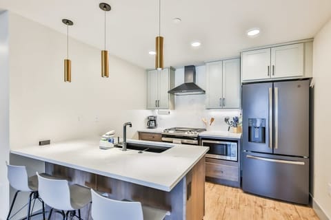 1. Gather in the beautifully designed chef’s kitchen, where elegance meets effortless functionality.