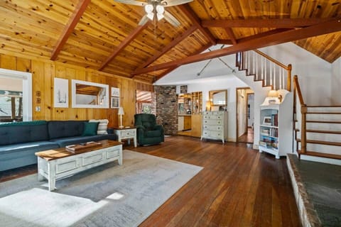 Ascend to comfort and tranquility! Follow these stairs leading to a bed and bath upstairs, while a hallway leads toward the serene bedroom downstairs. Your retreat, split between levels, ensures a perfect balance of privacy and convenience. ️
