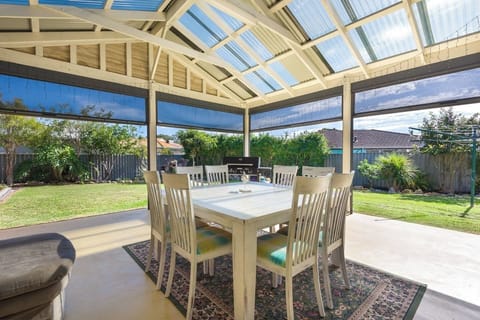 Outdoor living - wind and weatherproof blinds, BBQ, wall heater, fan and comfy couch :)