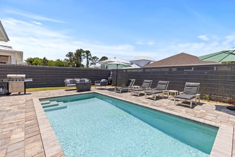 Your private pool awaits with sparkling waters, plush loungers for soaking up sunshine, and a built-in grill for poolside dining perfection.