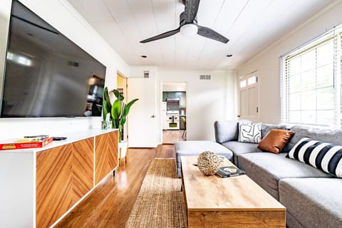 Comfy and welcoming living room with 65" flat screen TV