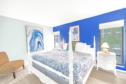 Tropical view bedroom in Siesta Key vacation rental near beach.