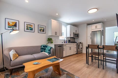 Our cozy kitchen is designed for your comfort! Enjoy a fridge, sink, and microwave, plus a comfy sofa and table for meals—perfect for unwinding after a day of adventure!
